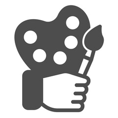 Palette with paintbrush in hand solid icon, art therapy concept. Vector graphics. Painter hand with brush and palette sign on white background, glyph style icon for mobile or web design.