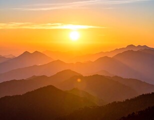 Golden sunrise over layered mountain ranges