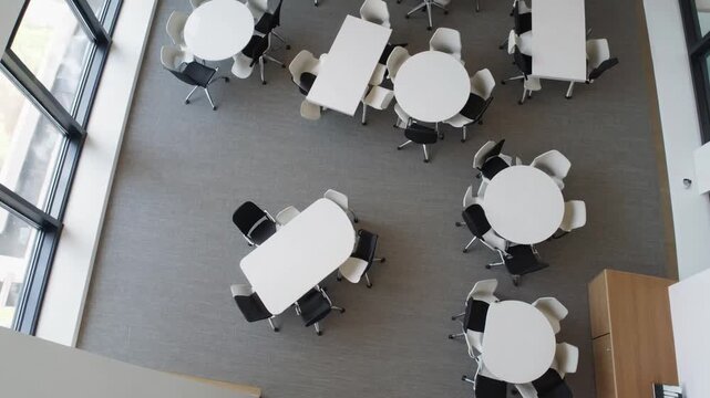 Top-Down View of Modern Contemporary Office Room Design with Round Tables and Chairs