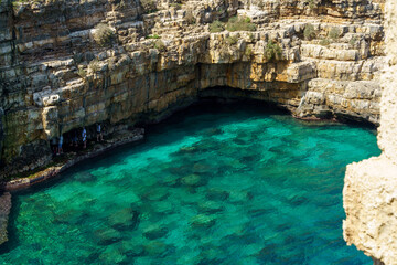 Close-up of turquoise sea water and rocky cliffs in Polignano a Mare, Apulia, Italy