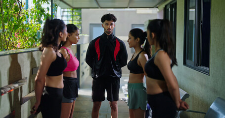 Indian young adult gen z sports woman lady group team fit coach man talk speak share plan ideas day...