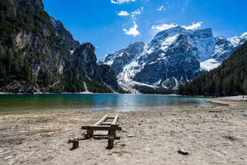 Lonely beach at Lake Braies, Lake Prags, Lake Braies, Lago di Braies,Pragser Wildsee in the Dolomites in South Tyrol, Italy. Hiking and holidays in South Tyrol.