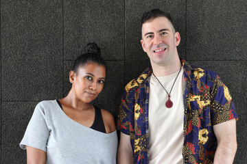 Asian Indian adult woman and Caucasian adult man urban rooftop outdoor casual pose walk talk activity friend colleague various expression