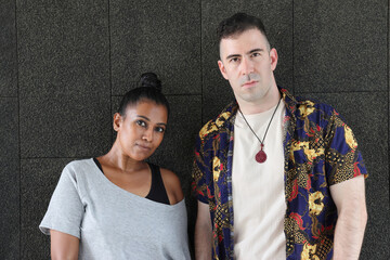 Asian Indian adult woman and Caucasian adult man urban rooftop outdoor casual pose walk talk activity friend colleague various expression