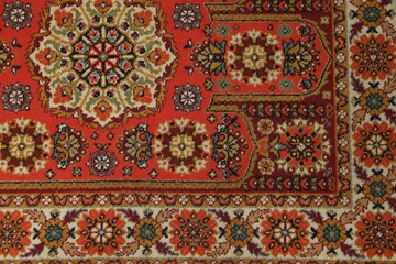 Soft red carpet with pattern as background, top view. Used stuff