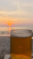 Beer glasses on a beach table in the evening