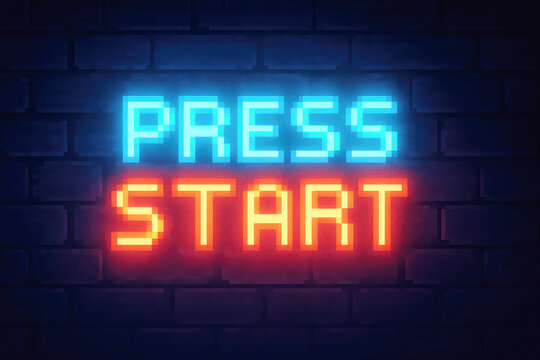 Neon Pixelated Press Start Sign Glowing Blue and Red on Brick Wall image photo