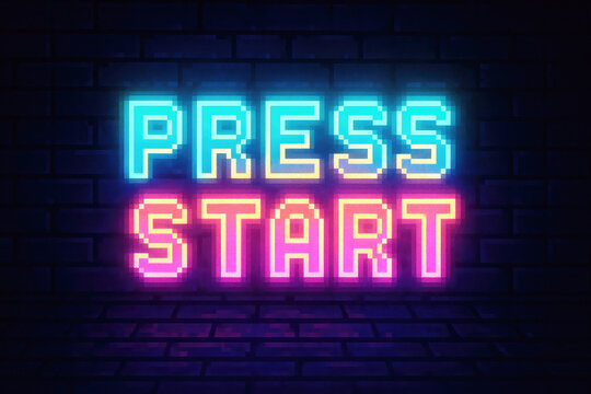 Neon Pixelated Press Start Sign Glowing Blue and Pink on Brick Wall with Floor image photo