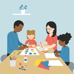 Family creating art together at a table indoors.