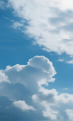 Obraz premium Beautiful fluffy white clouds float across a bright blue summer sky