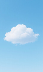 Minimalist nature background of a single perfect white cumulus cloud floating in a vast serene light blue sky