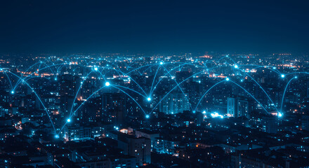 Futuristic cityscape with glowing blue network connections at night