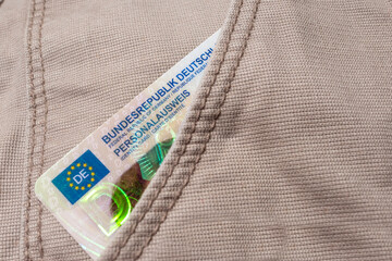 German ID card with EU flag in jeans pocket, Modern European personal document, European integration and legal rights, EU citizen travel, passport control border