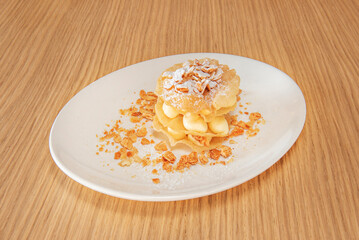 Coffee sponge cake with mousse filling Tiramisu and chocolate-covered coffee bean decoration