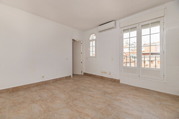 Bare space with distressed wood flooring, ideal for an industrial or vintage style