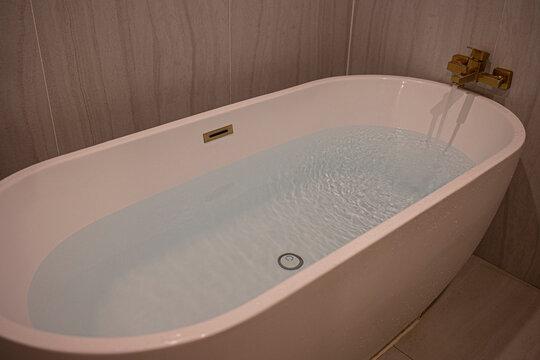 Water poured into the tub. Full bath.