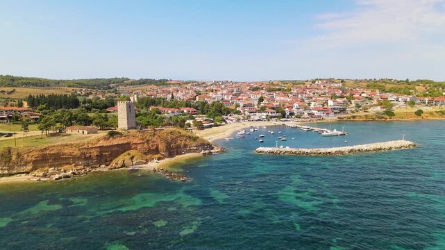 Sant Paul's Byzantine Tower in Nea Fokea, Kassandra Halkidiki, Greece. Aerial panoramic drone view from above, top view from drone. Summer holidays Europe
