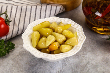 Turkish traditional marinated mini chili peppers