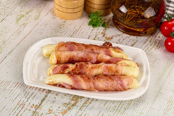 Hot mozzarella sticks with bacon