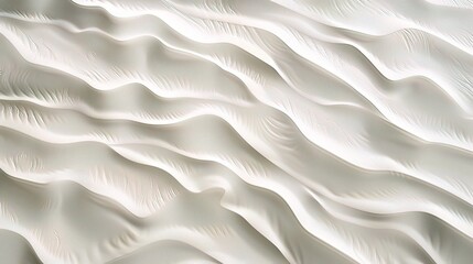 Obraz premium Top view of a white wall with wavy patterns.