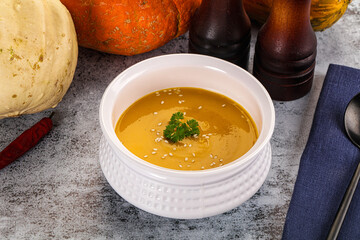 Vegan pumpkin cream soup served sesam