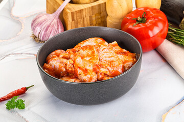 Raw marinated uncooked chicken wings