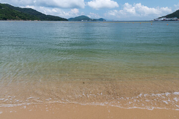 Silvermine Bay Beach located on Tung Wan Tau Road in Mui Wo, Lantau Island, Hong Kong. Seascape and nature, sunny day