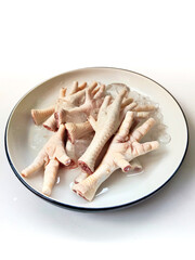 Raw and Cleaned Chicken Feet on White Background