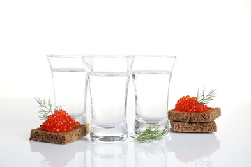 Russian vodka and red caviar sandwiches isolated on white