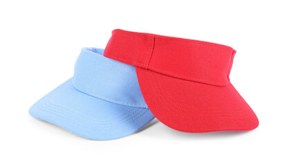 Red and light blue visor caps isolated on white. Mockup for design