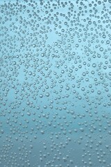 Soda water with bubbles of gas in glass, closeup
