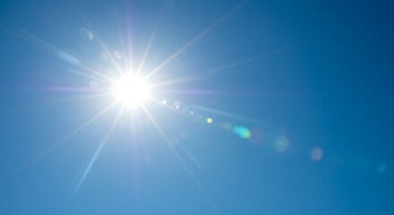 Radiant sunbeams in azure expanse offer a serene visual escape and summertime bliss