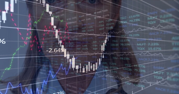Senior analyst in jacket analyzing data at trading desk, with candlesticks and tickers - Powered by Adobe