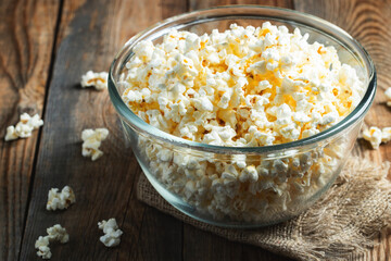 Popcorn on wood color background.Food and snack concepts ideas.Minimal style top view mockup