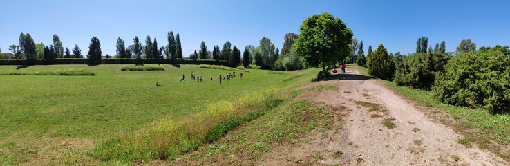 Ostia, Rome, April 15, 2025, children from an elementary school, on a school trip, have fun running and playing in a protected ecological oasis.