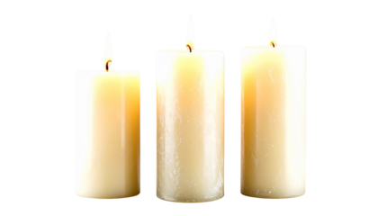 Pillar candles with flames illuminated, isolated on white background
