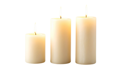 Pillar candles with flames illuminated, isolated on white background
