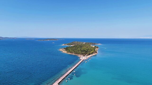 4K video of Demircili Bay with its turquoise beaches and magnificent peninsula in Urla. Izmir, Turkiye.