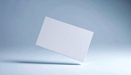 Floating blank business card on light background with soft shadows