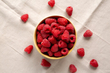 Organic Raw Red Raspberries in a Bowl, top view.