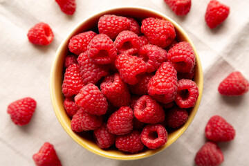 Organic Raw Red Raspberries in a Bowl, top view.