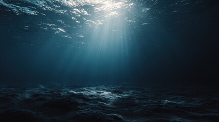 A serene underwater scene with sun rays filtering through the surface. The image evokes a sense of deep-sea exploration, tranquility, and the mystery of the unknown.