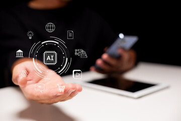 Artificial intelligence and digital innovation. A businessman uses smartphone and tablet in a modern office with AI icons, representing automation, smart solutions, and future business technology.