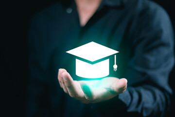 Businessman holding graduation hat online learning education student university e-learning technology concept success achievement diploma academic cognition course business cap school training