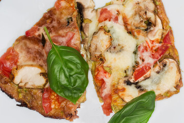 Zucchini pizza with chicken meat and mushrooms filling, top view