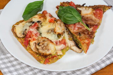 Zucchini pizza with chicken meat and mushrooms filling, top view