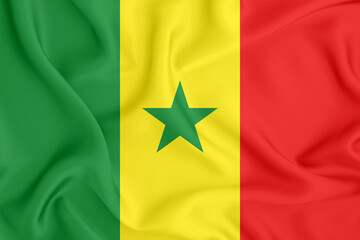 flag of the Republic of Senegal with a five-pointed star and three horizontal stripes on satin fabric with folds and shadows