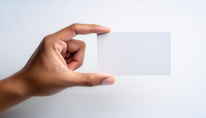 Fototapeta premium hand holding a blank card against a white background for creative design and marketing ideas no background white background
