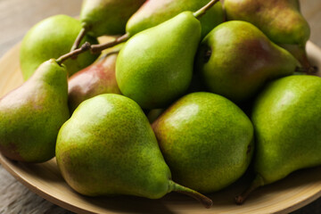 Many fresh ripe pears on table, closeup