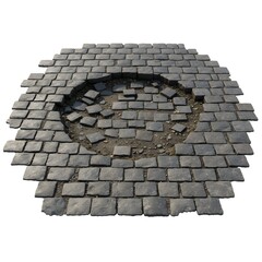 Damaged pavement, showcasing a circular area of broken stones and exposed earth